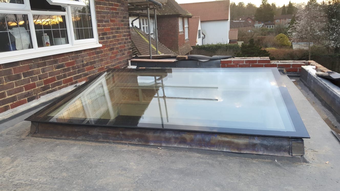 Rooflight on a flat roof with neighbouring rooftops beyond