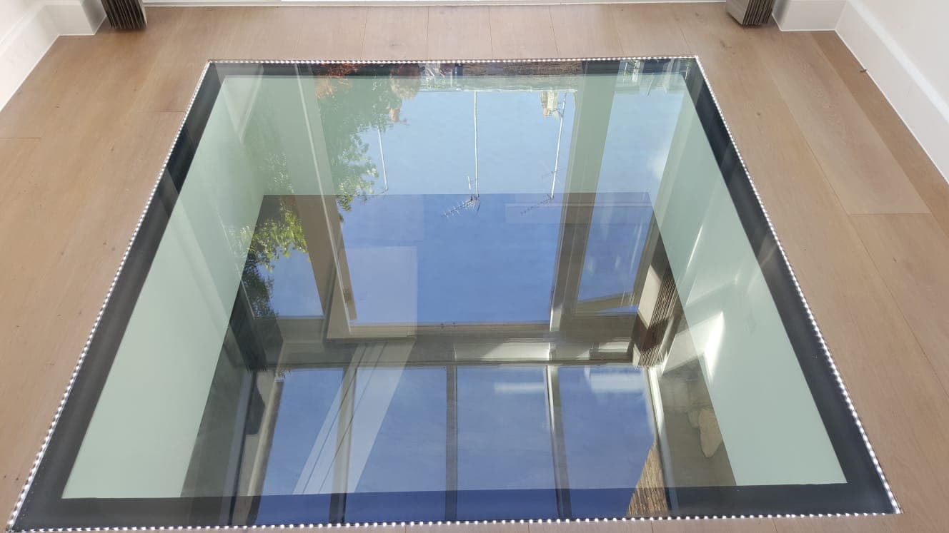 Walk-on glass seen from the room beneath, looking up through the panel to the sky